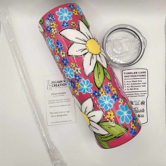 Floral tumbler with hand-painted white daisies with blue, orange, and yellow wildflowers.